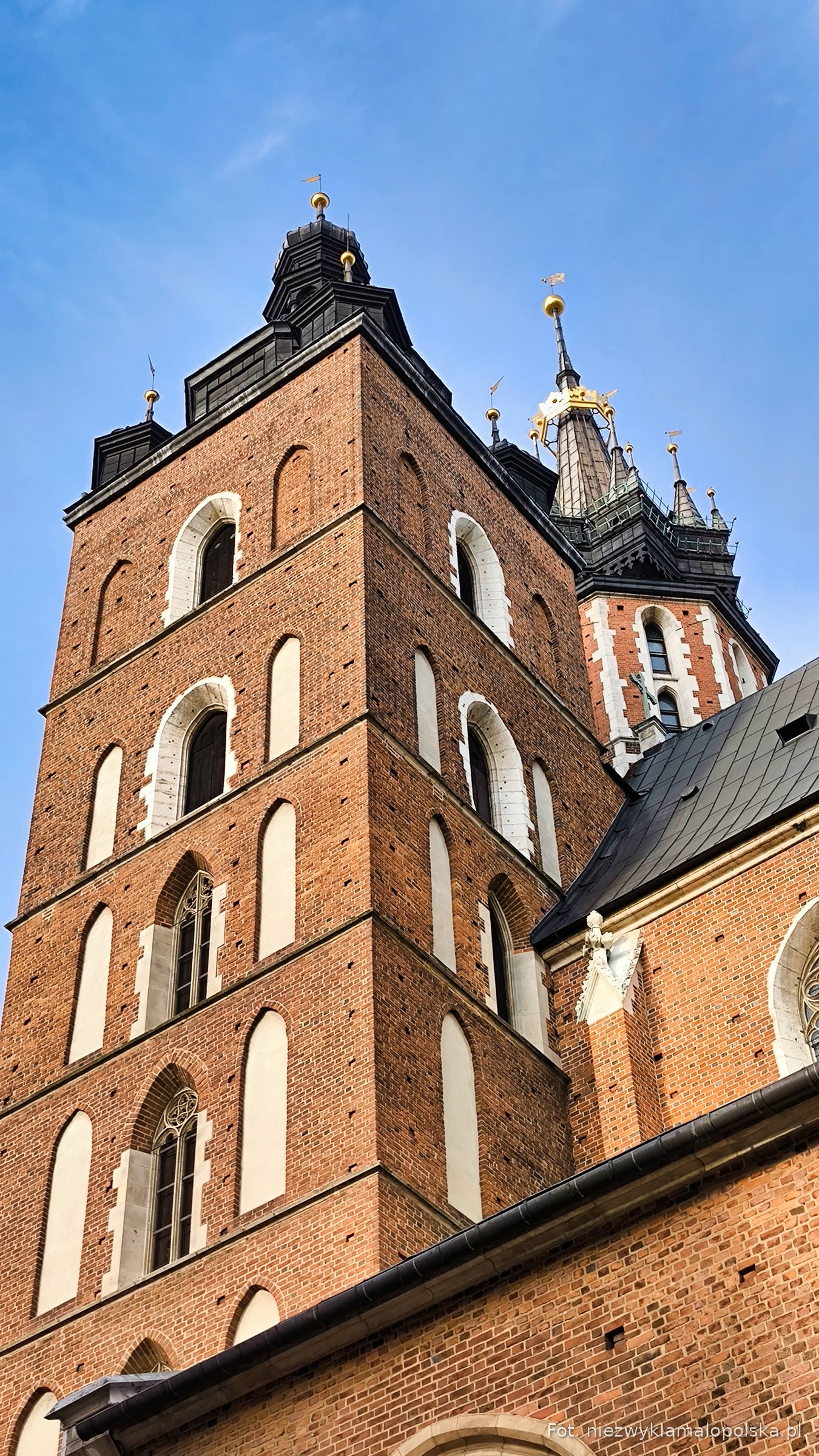 The taller tower of St Mary's Basilica, where the hejnał is played every hour